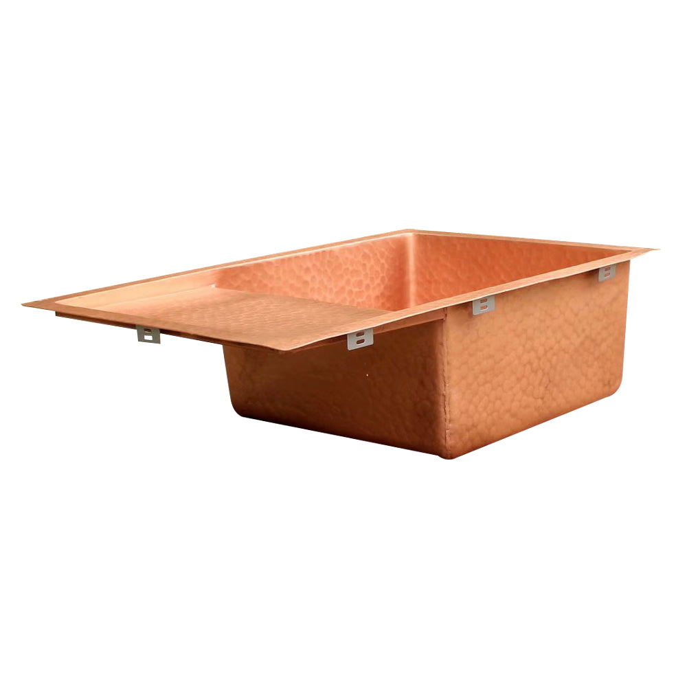 copper_kitchen_sink_workstation_hammered_ledges_cutting_board